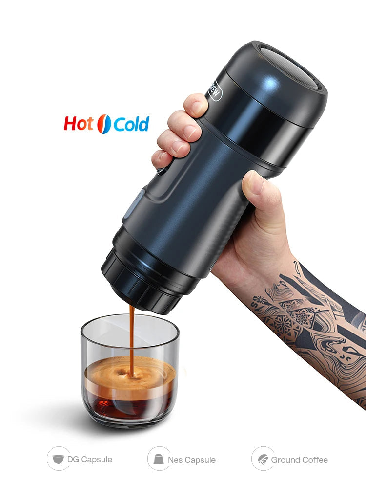 Hand holding a black HiBREW coffee maker pouring coffee into a glass.